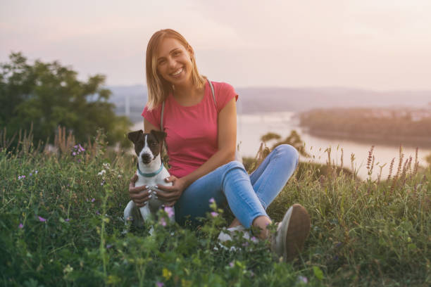 istock Woman with her dog Jack Russell Terrier 1048856186