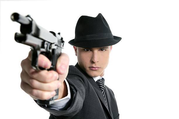 istock Classic mafia portrait, man with black suit and gun 104885808