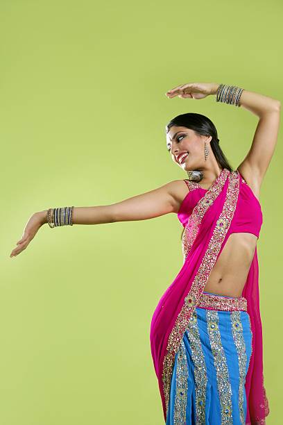 istock Beautiful indian young brunette woman dancing 104885853