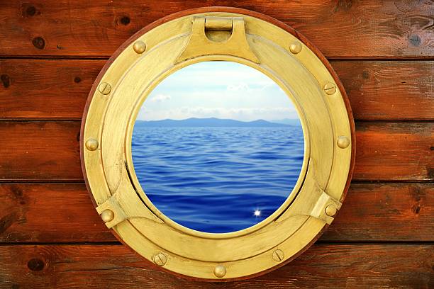 istock Boat closed porthole with vacation seascape view 104885906