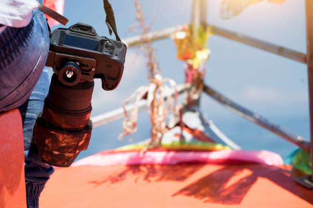 istock Holding camera, standby for taking photo 1048860346