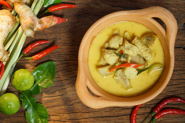 istock Thai food: Fish ball green curry on wooden background. 1048863552