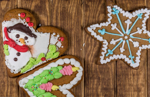 istock Three Gingerbread Cookies on Wood 1048867284