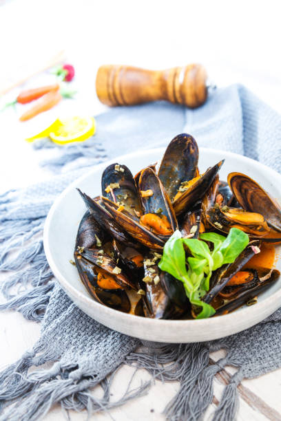 istock Mussel with white wine sauce on table 1048868116