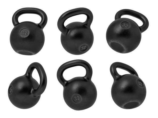 istock 3d rendering of 32 kg several black iron kettlebells hanging at different angles on a white background. 1048873472