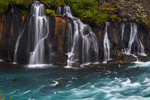 Barnafoss (Bjarnafoss) waterfall flowing into blue river. Beautiful Iceland.