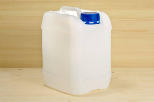 istock Plastic canister on wooden background with clipping path 1048875774