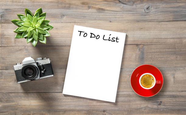 istock Office workplace flat lay Paper vintage photo camera coffee 1048876488