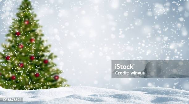 Blurred Christmas Tree In White Snowy Landscape Stock Photo - Download Image Now - Christmas, Backgrounds, Christmas Tree