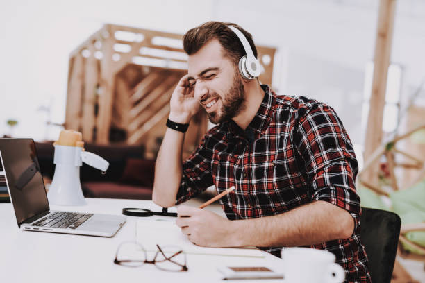 istock Businessman. Listen Music. Working. Ideas. Light. 1048882652