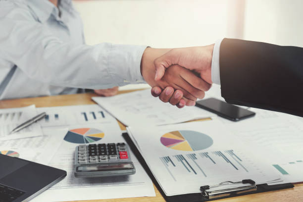 istock businessman shake hand in office 1048883118