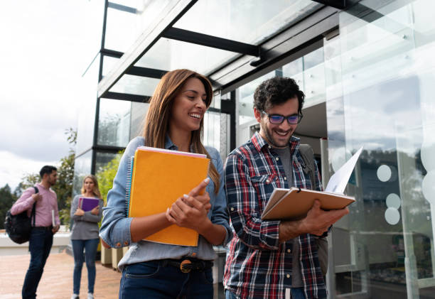 istock Happy couple of college students smiling 1048886492