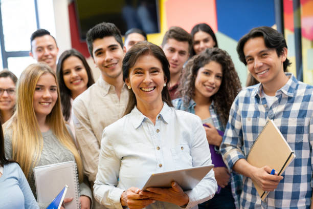 istock Happy teacher with a group of students at a university 1048886708