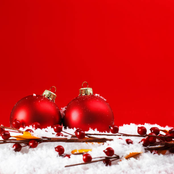 istock two christmas balls on the snow 1048886970
