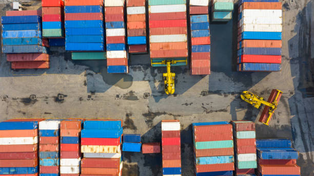 istock Container ship in export and import business and logistics. Shipping cargo to harbor by crane. Water transport International. Aerial view and top view. 1048890702