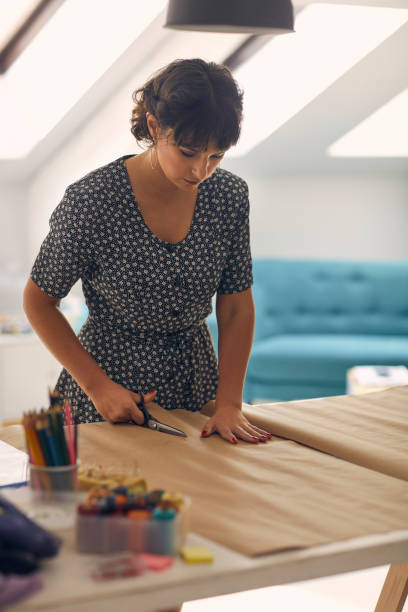 istock Female Fashion Designer In Her Workshop 1048891160