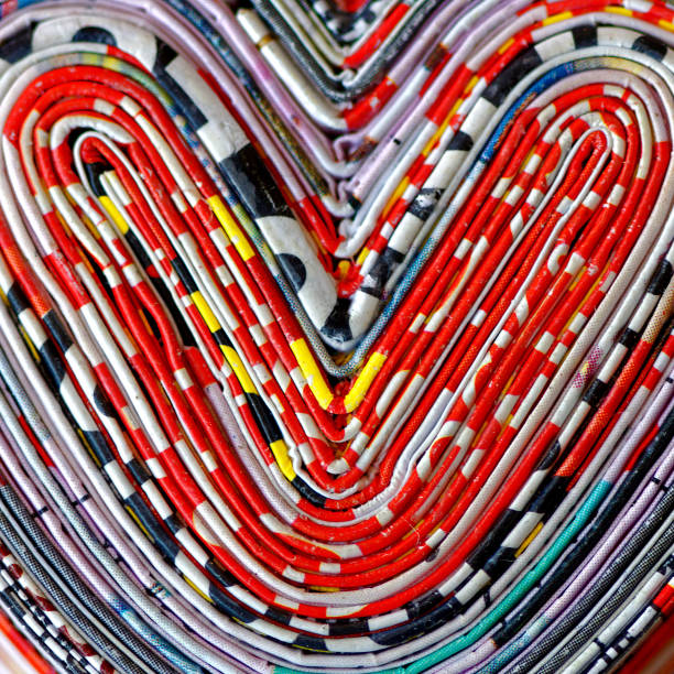 hearts  - abstract newspaper macro heart shape stock-fotos und bilder