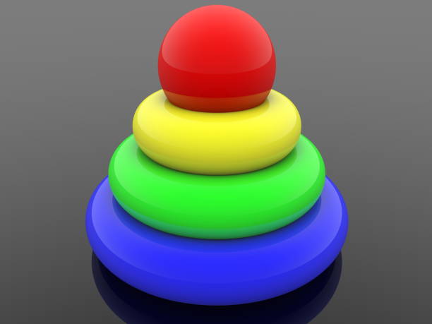 istock Toy pyramid in various colors on black 1048891654