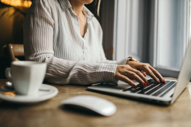 istock Attractive woman working on a laptop computer 1048895716