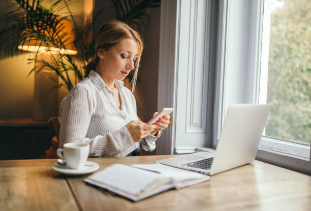 istock Attractive woman working on a laptop computer 1048896794