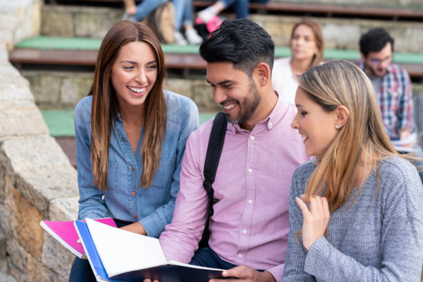 istock Group of college students talking and looking very happy 1048897002