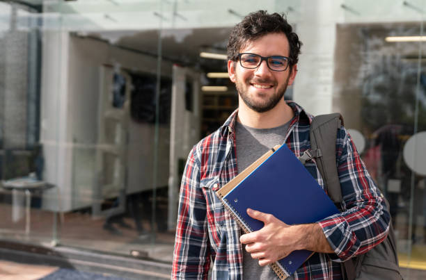 istock Happy male student at the university 1048897020