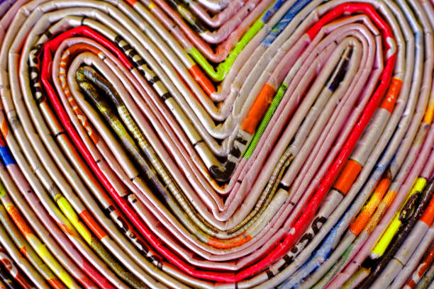 hearts heart shape of recycled rolled newspaper pages, detail abstract newspaper macro heart shape stock pictures, royalty-free photos & images