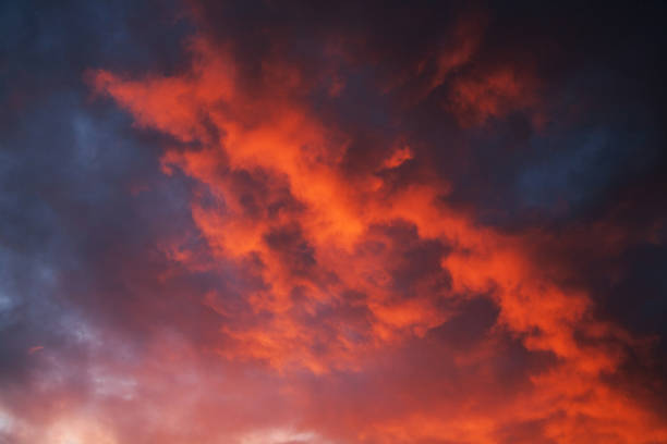 istock red cumulus clouds illuminated by the setting sun in the evening 1048906612