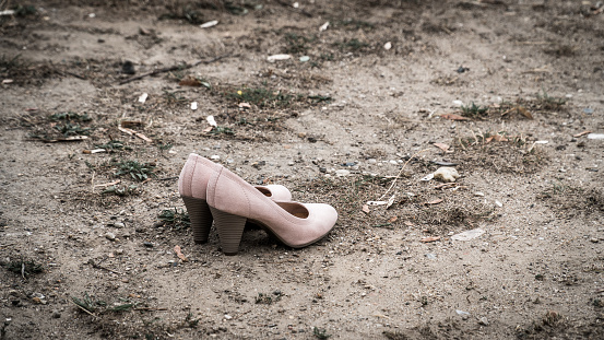 High heels stand in the dirt