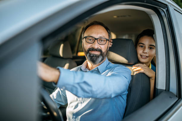 istock Dad drives his son in school 1048911914