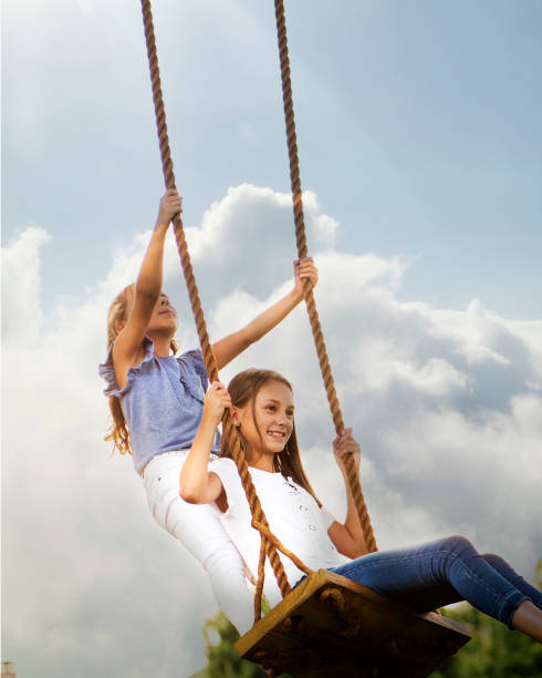istock Little GIrl Swinging 1048915682
