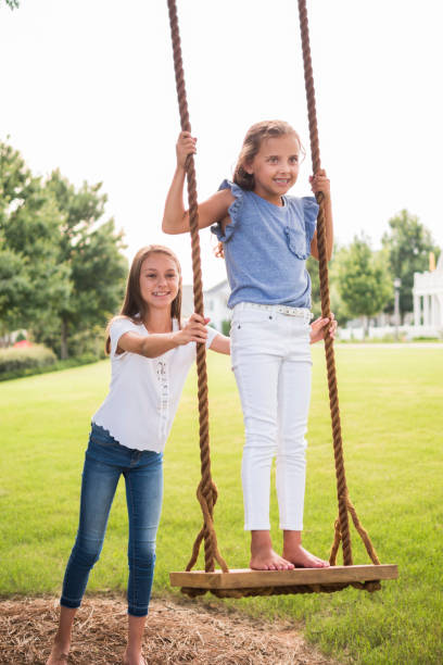 istock Little GIrl Swinging 1048915818