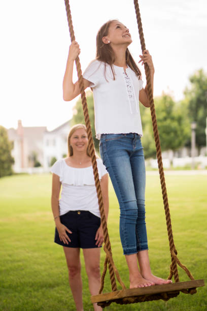 istock Little GIrl Swinging 1048916142
