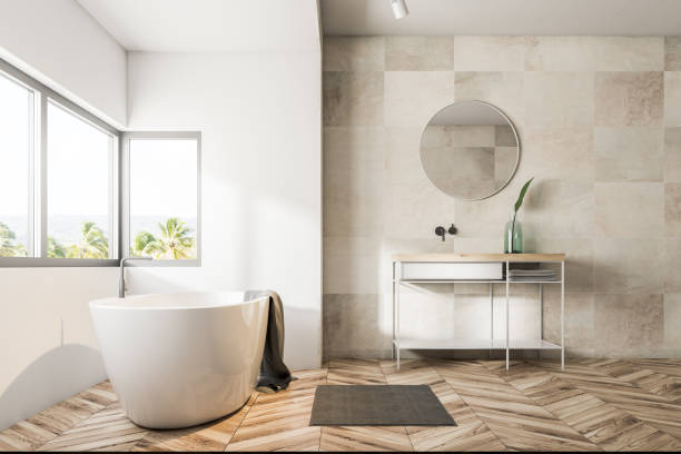 istock White tile bathroom interior, tub and sink 1048917254