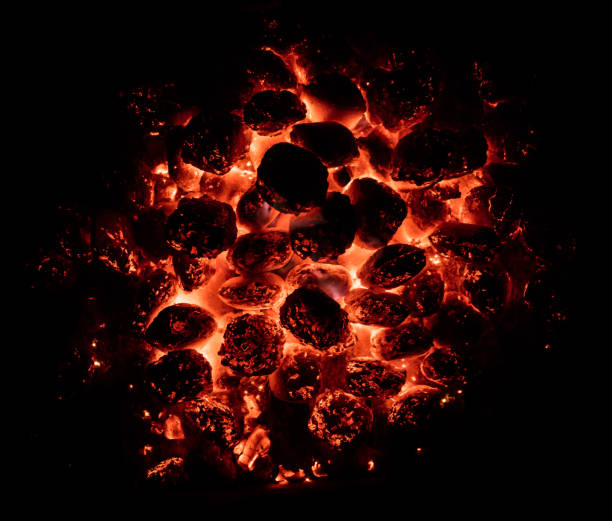 Flaming hot charcoal briquettes in detail Flaming hot charcoal briquettes in detail. BBQ grill texture, food background char grilled photos stock pictures, royalty-free photos & images