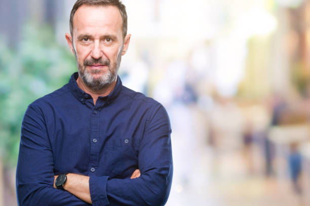 istock Middle age hoary senior man over isolated background with serious expression on face. Simple and natural looking at the camera. 1048927912