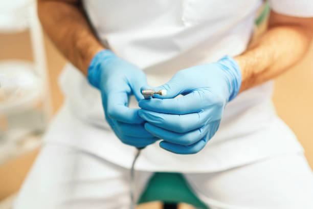 istock Closeup shot of dentists hands holding dental tool 1048932014
