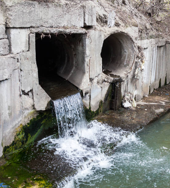 istock Run-off pipes discharging water 1048932352