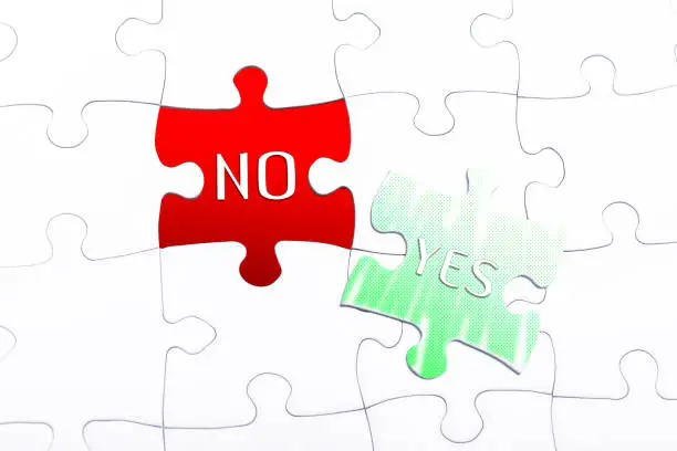 Photo of The Words Yes And No In A Missing Piece Jigsaw Puzzle