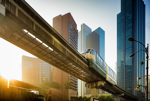 Kuala Lumpur elevated Monorail in Chow Kit back lit by sunrise