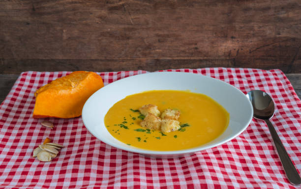 istock Delicious pumpkin soup with croutons 1048938086