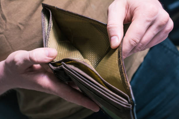 istock Man Showing His Empty Wallet - No Money Left Concept 1048941860
