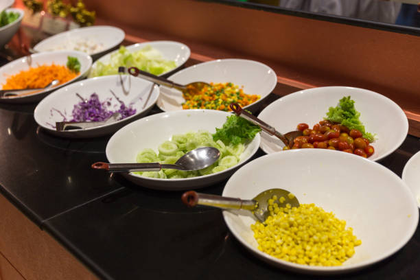 istock Variety of fresh salads in a buffet 1048950324