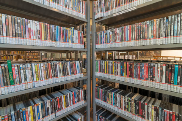 istock books on the shelf in a public library, bound, to be used as a background 1048951766