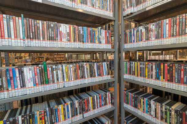 istock books on the shelf in a public library, bound, to be used as a background 1048954528