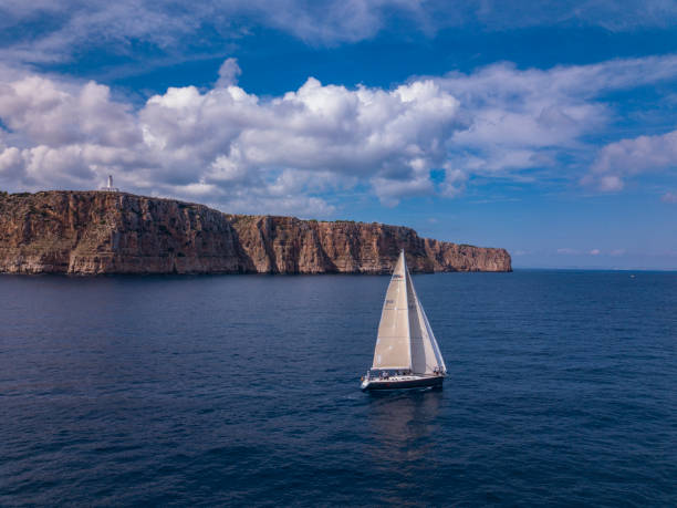 Sailboat by the coast