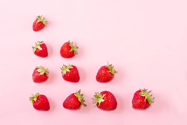 istock Strawberry on pastel pink background. 1048960088