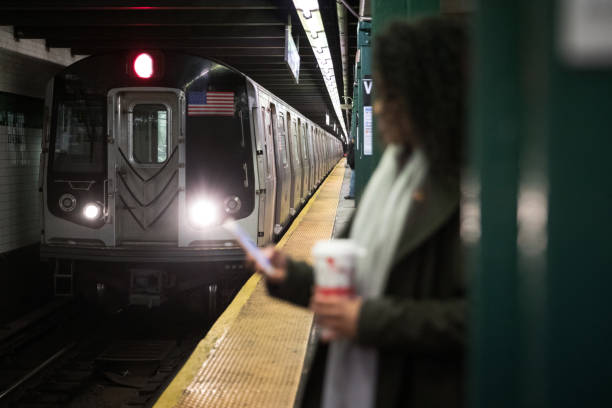 Woman waiting the subway train in the morning