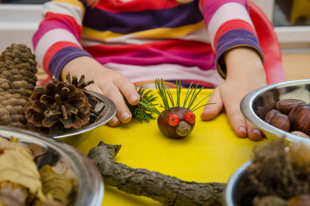istock lovely child having fun with autumn fruits 1048969844