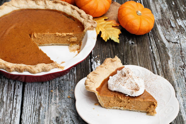 istock Delicious Pumpkin Pie Slice with Whiiped Cream 1048970968